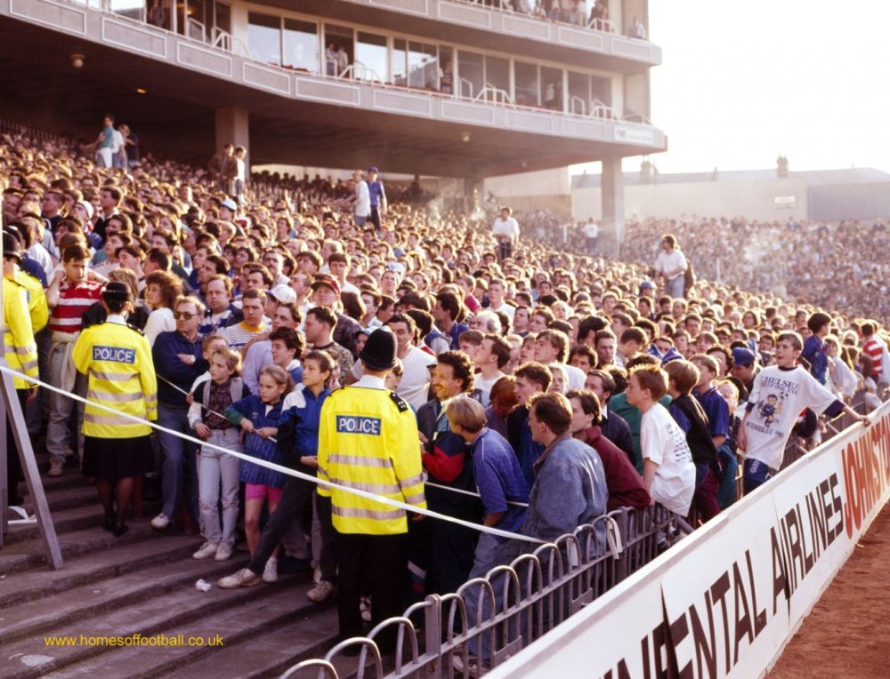 0006-Steaming-crowd-Chelseaat-ArsenalEngland-year1990-by-Stuart-Roy-Clarke--1349x1030.jpg