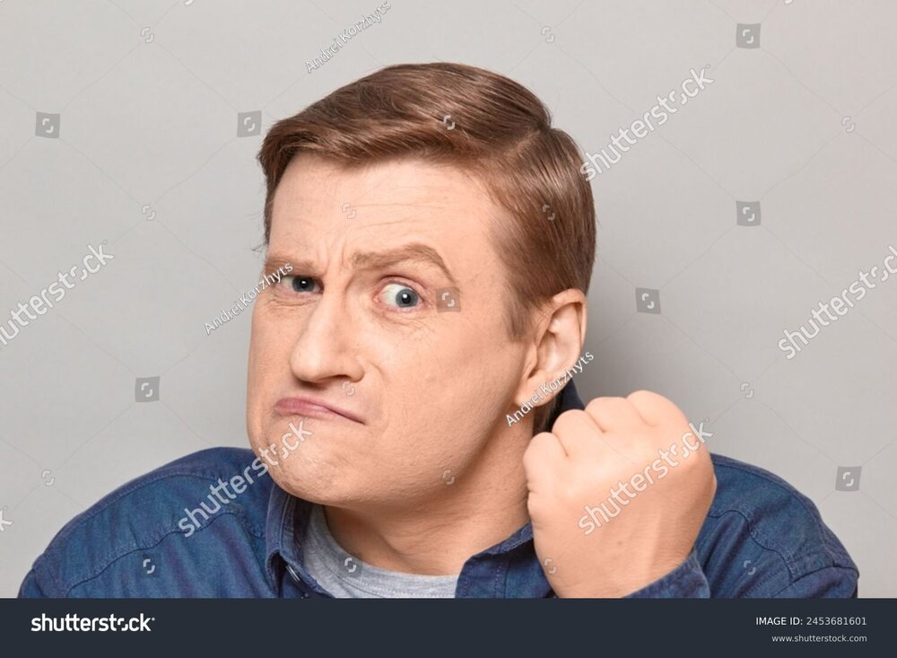 stock-photo-studio-close-up-portrait-of-angry-disgruntled-indignant-blond-mature-man-shaking-fist-near-face-in-2453681601.jpg